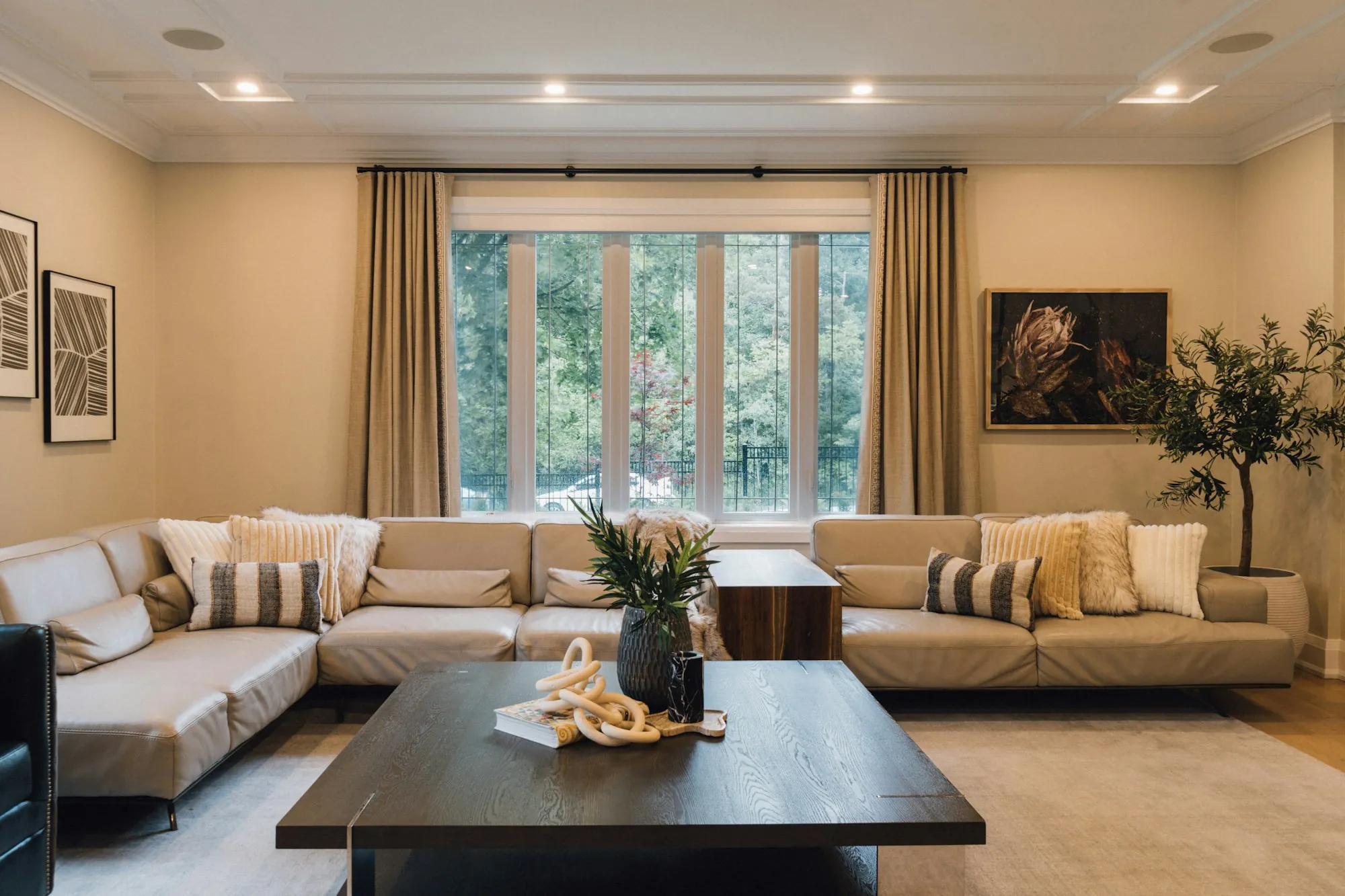 Warm living room with a sectional sofa facing a window